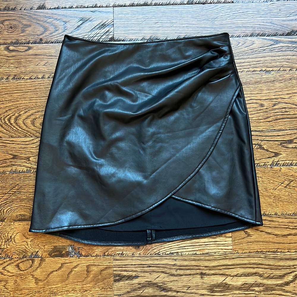 Rewash vegan leather mini skirt with cross front, size small.